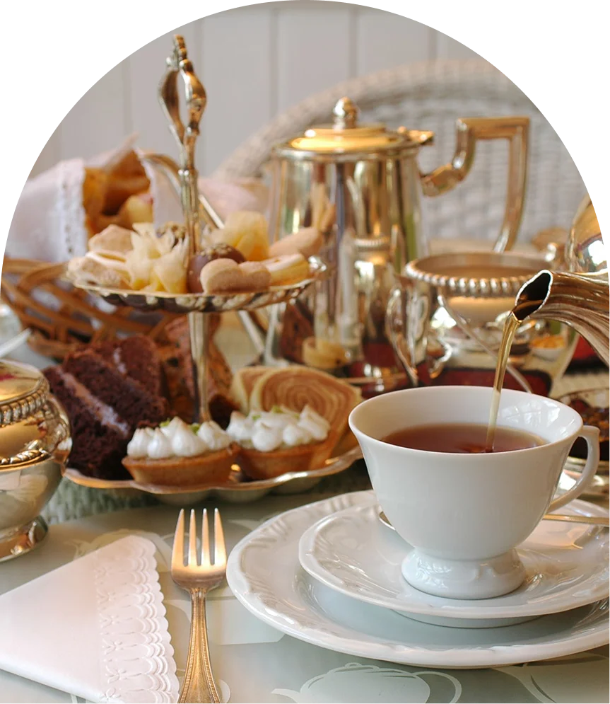 Elegant afternoon tea with pastries and silverware.